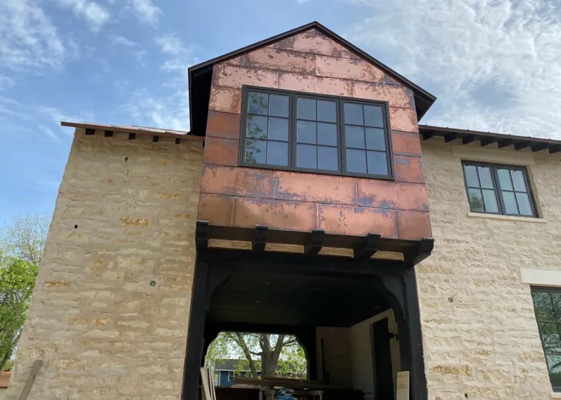 Copper metal panel facade on a stone building for Skylight Installation in Dania Beach